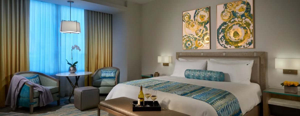 A guest room with art and colour accents — behind the spectacular shell, a contemporary, functional product.