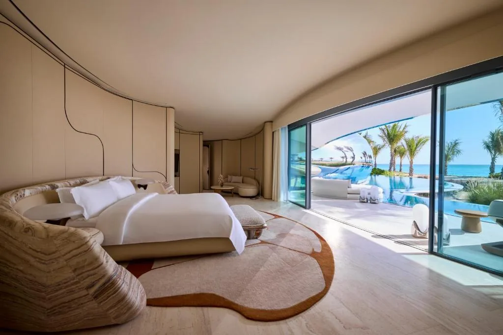 A sleeping area overlooking pool and sea — the guest experience is the result of early decisions on location, construction and operations.