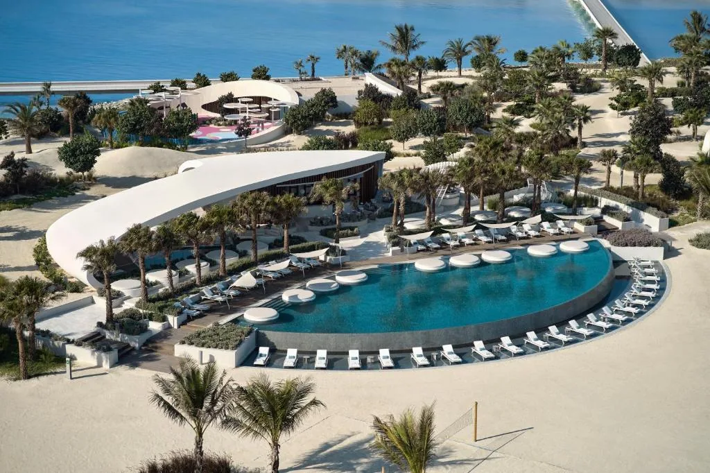 Pool and beach area from above — cooling, kitchen, laundry and water technology determine energy demand.