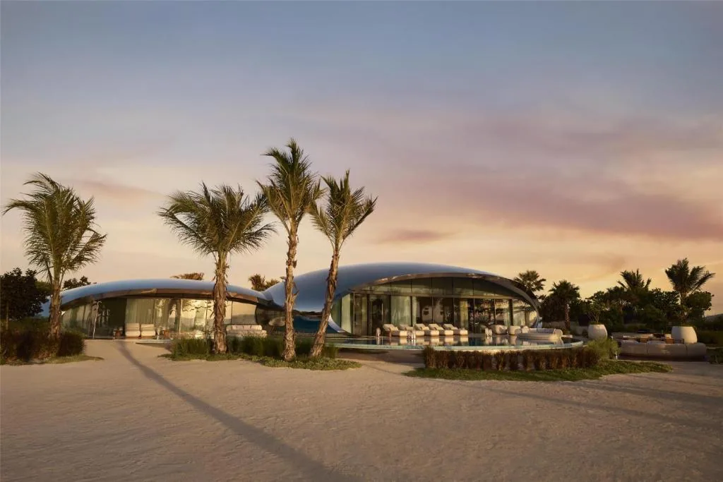 Prefabricated villa bodies with a rounded shell — built off-site and transported to their final position.